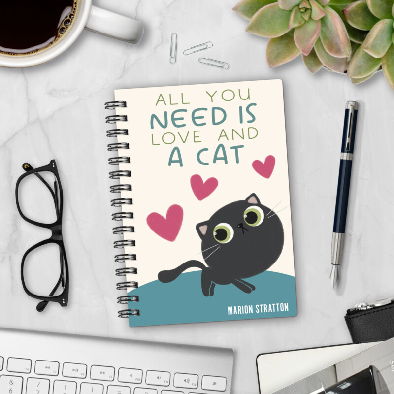 Personalized hardcover notebook in Smol Cat Energy design with cute black cat, pink hearts, and All You Need Is Love And A Cat text styled with pen