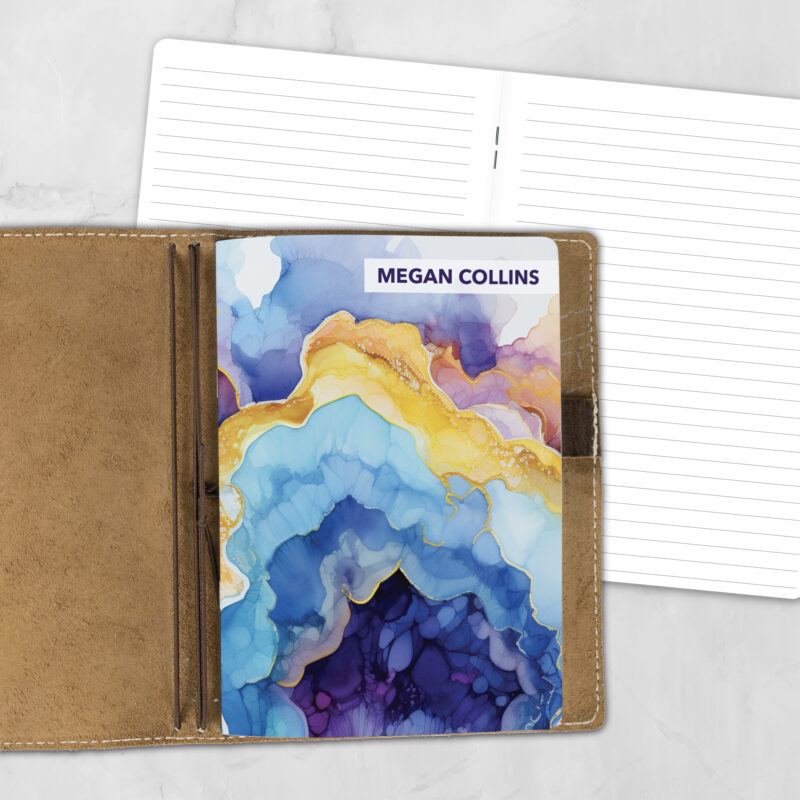 A5 Amethyst Geode personalized traveler's notebook refill showing the cover design inside a leather traveler's notebook cover, with lined refill pages visible behind.