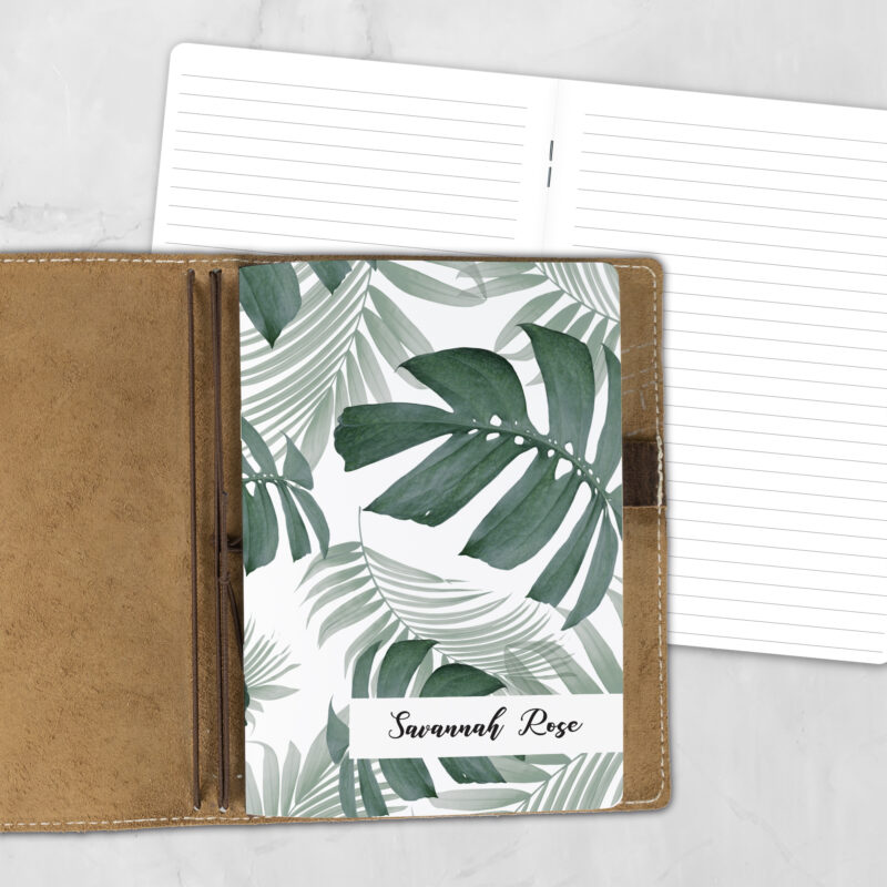 A5 Botanical AF personalized traveler's notebook refill showing the cover design inside a leather traveler's notebook cover, with lined refill pages visible behind.