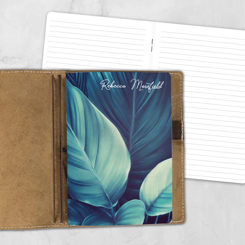 A5 Dark Forest lifestyle personalized traveler's notebook refill showing the cover design inside a leather traveler's notebook cover, with lined refill pages visible behind.
