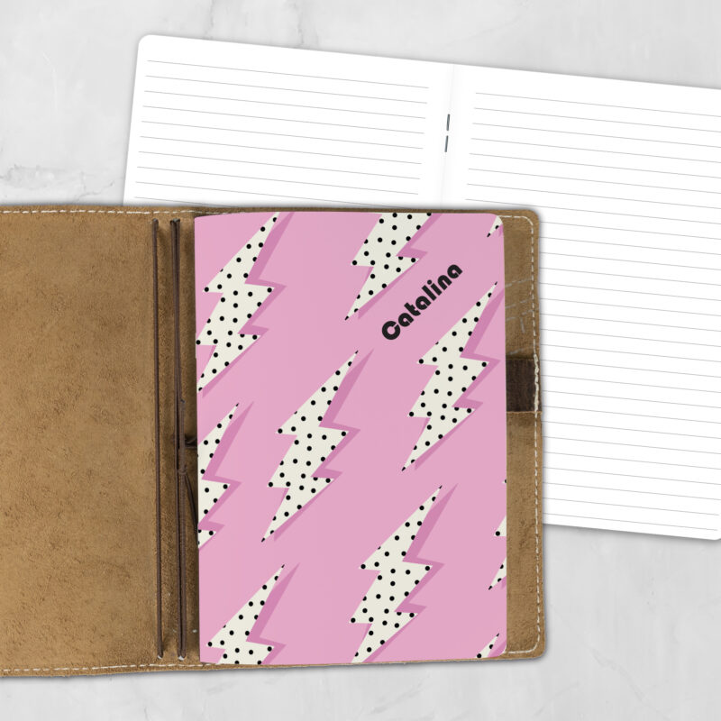 A5 Electric Candy personalized traveler's notebook refill showing the cover design inside a leather traveler's notebook cover, with lined refill pages visible behind.