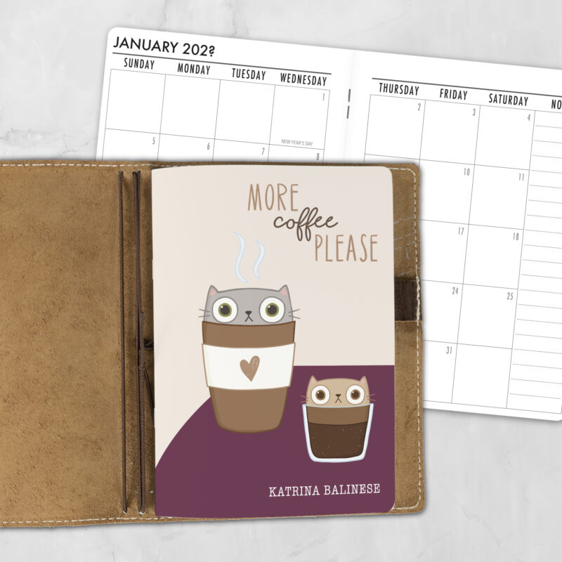 A5 Espurrresso Yourself personalized traveler's notebook refill showing the cover design inside a leather traveler's notebook cover, with a monthly calendar spread visible behind.
