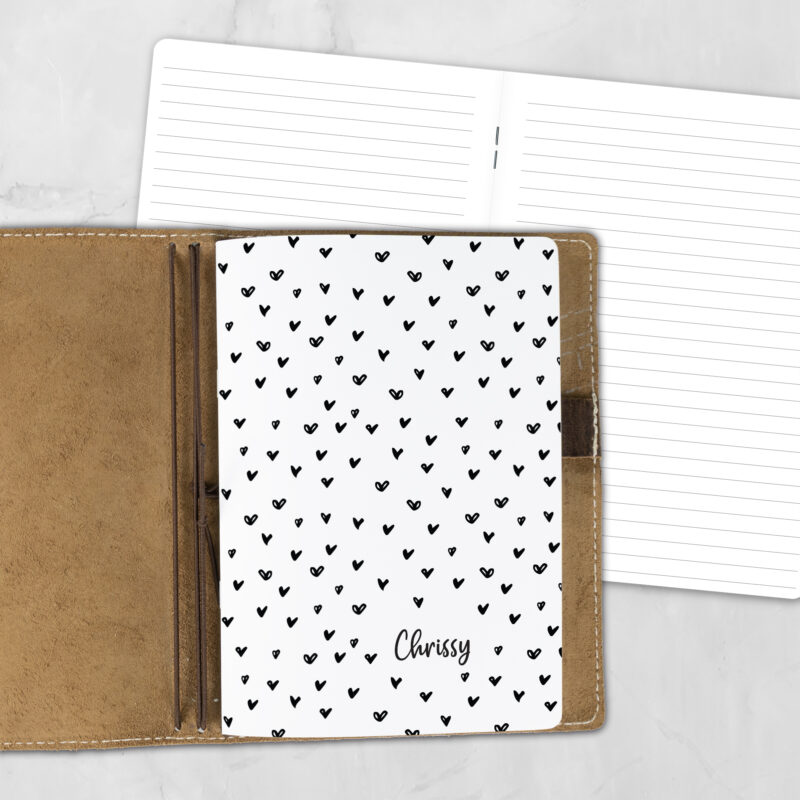 A5 Have a Heart personalized traveler's notebook refill showing the cover design inside a leather traveler's notebook cover, with lined refill pages visible behind.