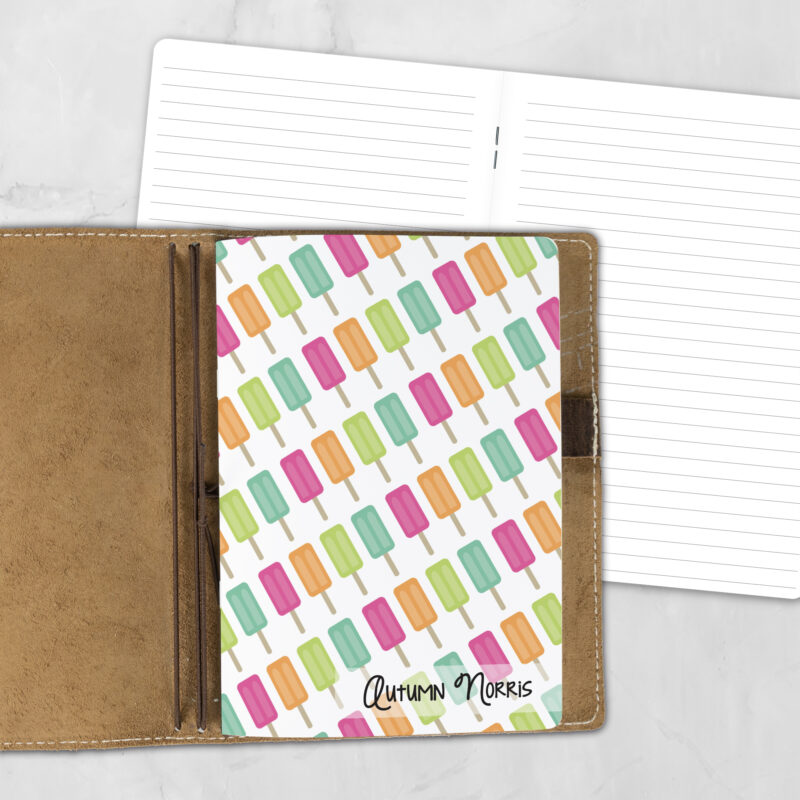 A5 Ice Cream Twins personalized traveler's notebook refill showing the cover design inside a leather traveler's notebook cover, with lined refill pages visible behind.