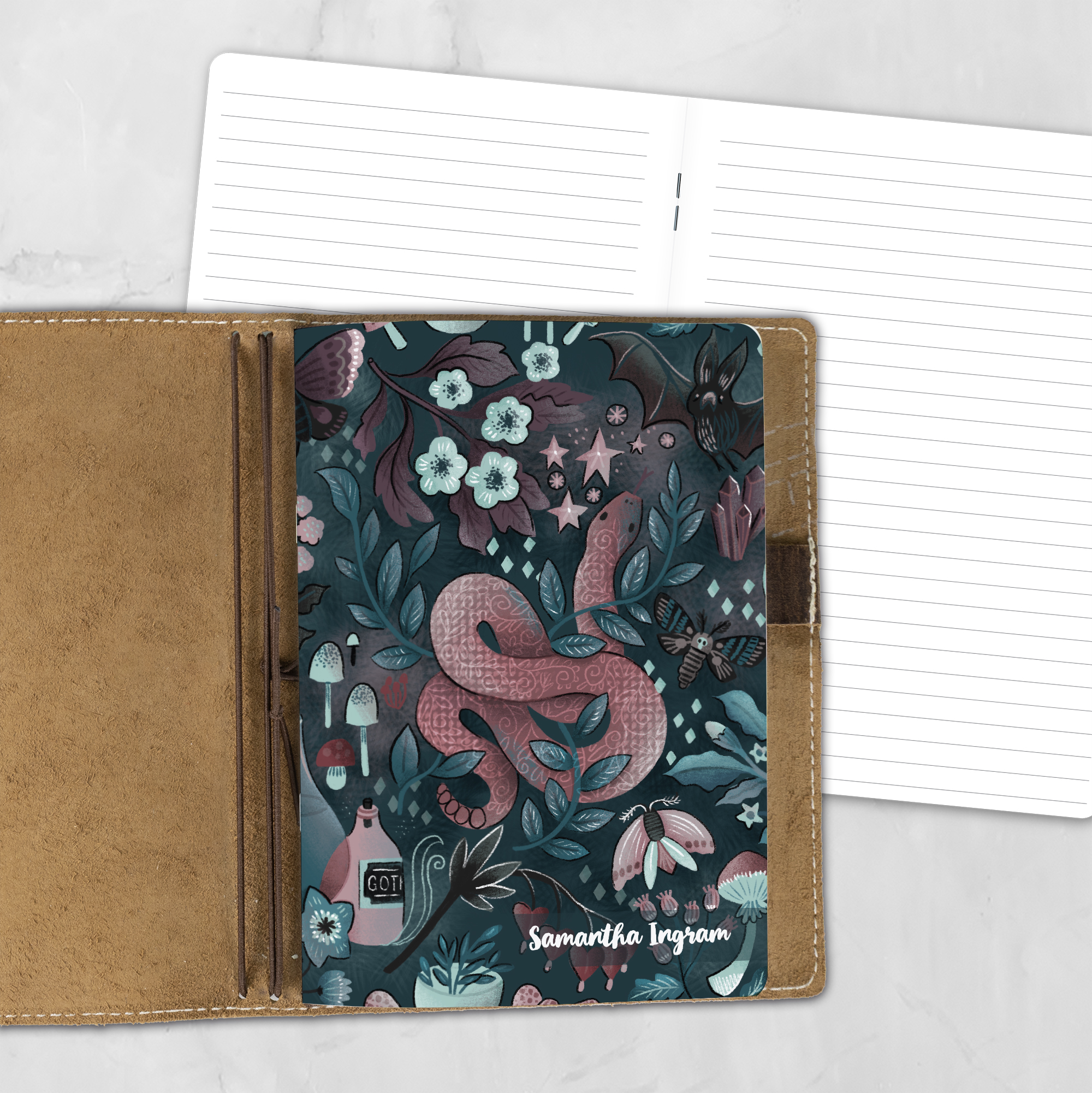 A5 Into the Night lifestyle personalized traveler's notebook refill showing the cover design inside a leather traveler's notebook cover, with lined refill pages visible behind.
