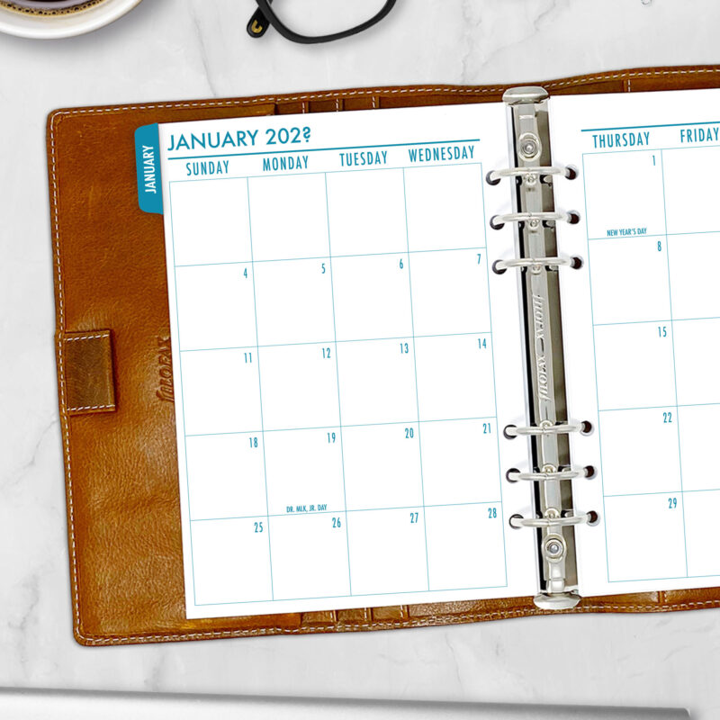 Month on 2 Pages planner insert in Midnight Sea design with colorful tabs in A5 size in brown ring binder