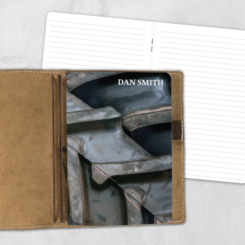 A5 Off Road Agenda Lifestyle personalized traveler's notebook refill showing the cover design inside a leather traveler's notebook cover, with lined refill pages visible behind.