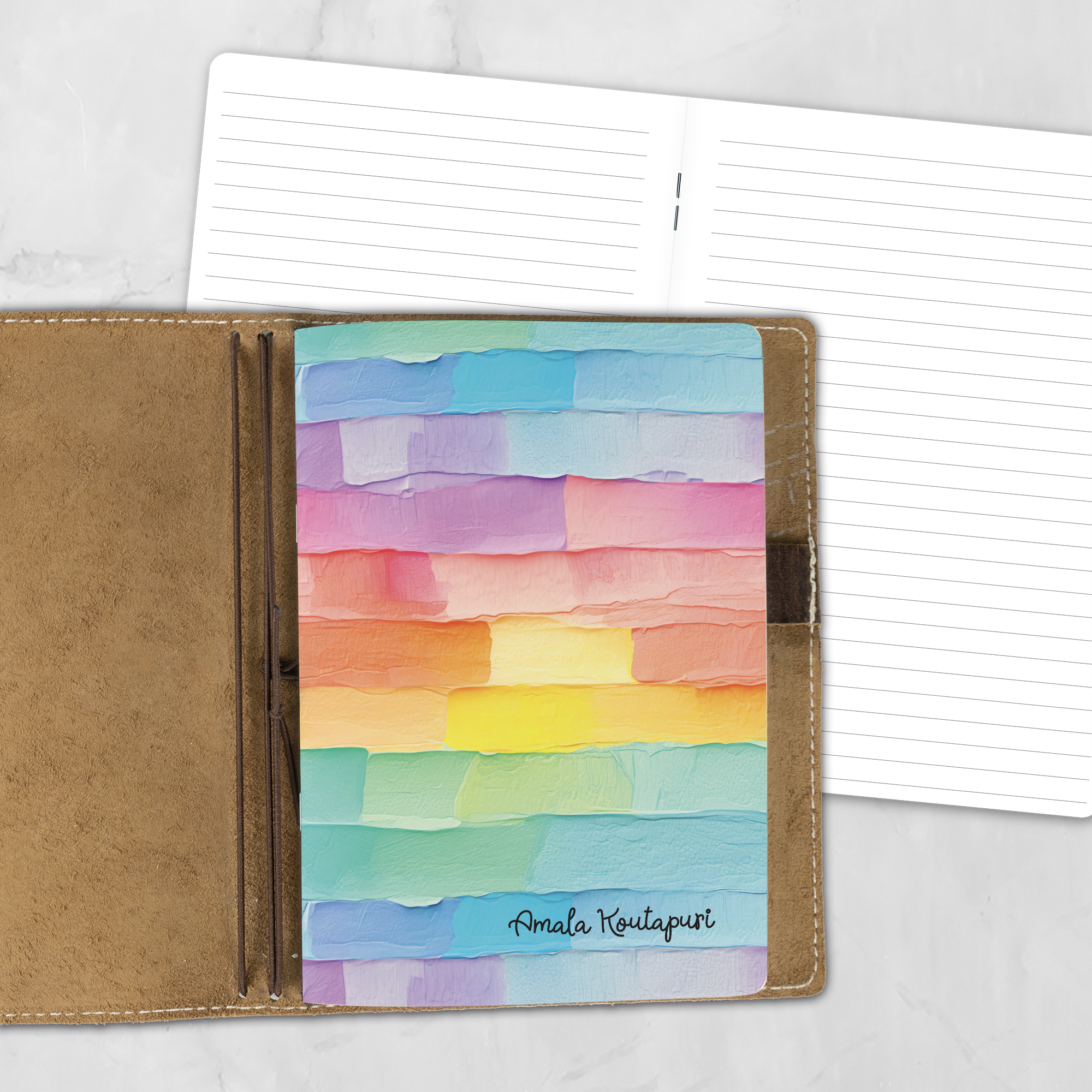 A5 Palette Cake personalized traveler's notebook refill showing the cover design inside a leather traveler's notebook cover, with lined refill pages visible behind.