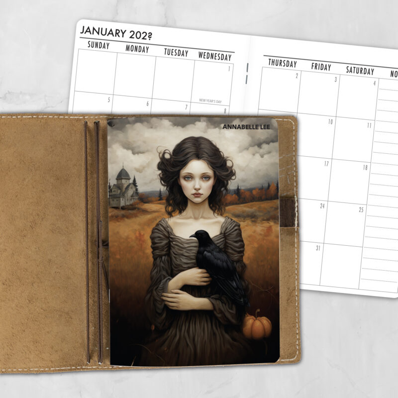 A5 Ravens Girl lifestyle personalized traveler's notebook refill showing the cover design inside a leather traveler's notebook cover, with a monthly calendar spread visible behind.