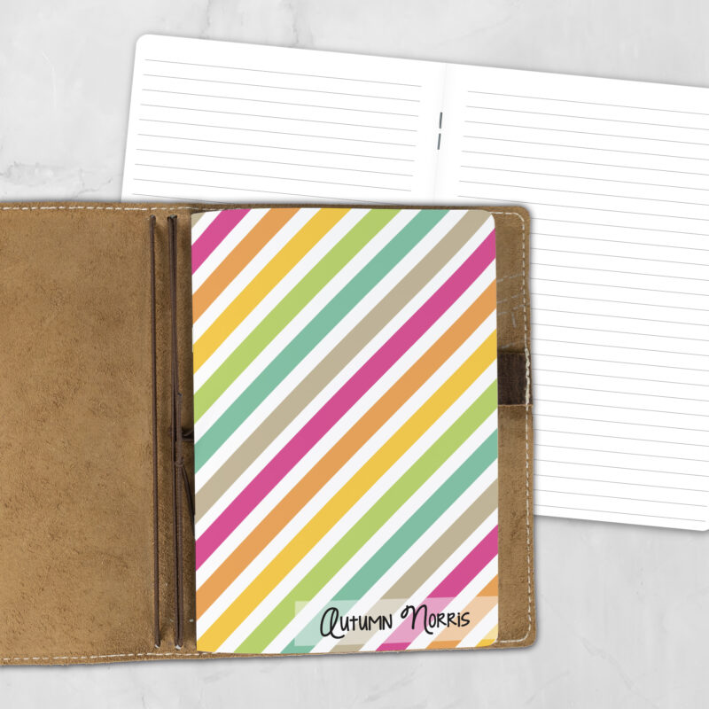 A5 Stripe Hype personalized traveler's notebook refill showing the cover design inside a leather traveler's notebook cover, with lined refill pages visible behind.
