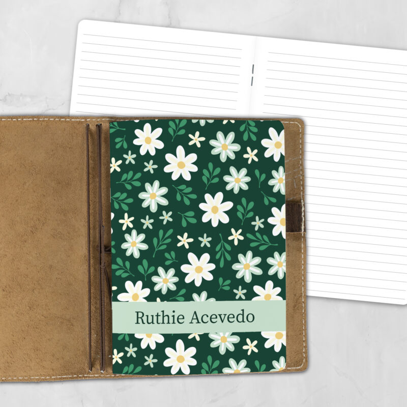 A5 Sunday Daisies personalized traveler's notebook refill showing the cover design inside a leather traveler's notebook cover, with lined refill pages visible behind.