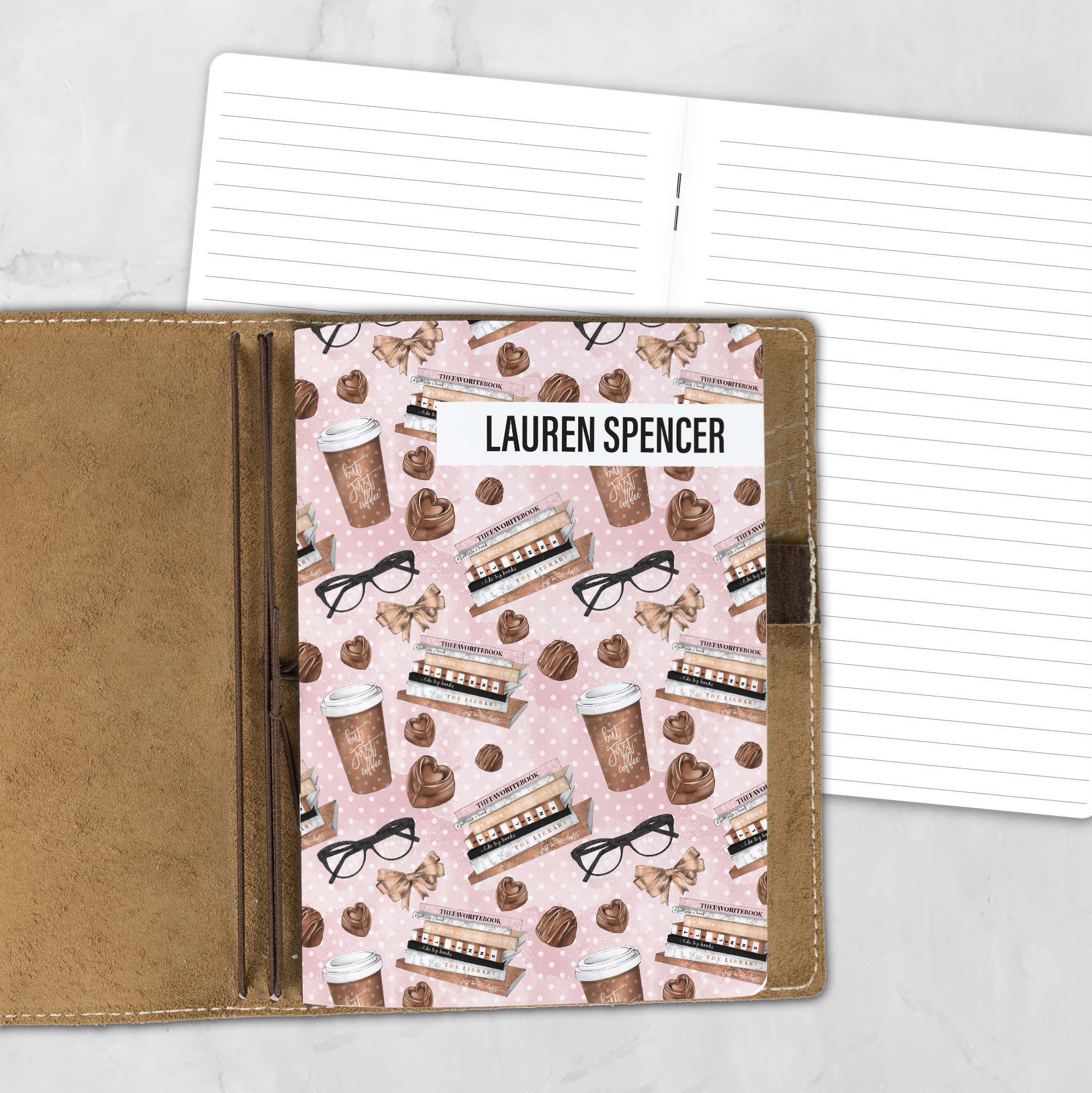 A5 The Brew Review personalized traveler's notebook refill showing the cover design inside a leather traveler's notebook cover, with lined refill pages visible behind.