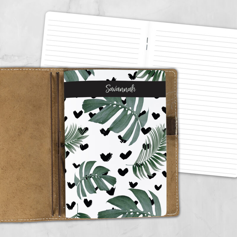 A5 Tropical Love personalized traveler's notebook refill showing the cover design inside a leather traveler's notebook cover, with lined refill pages visible behind.