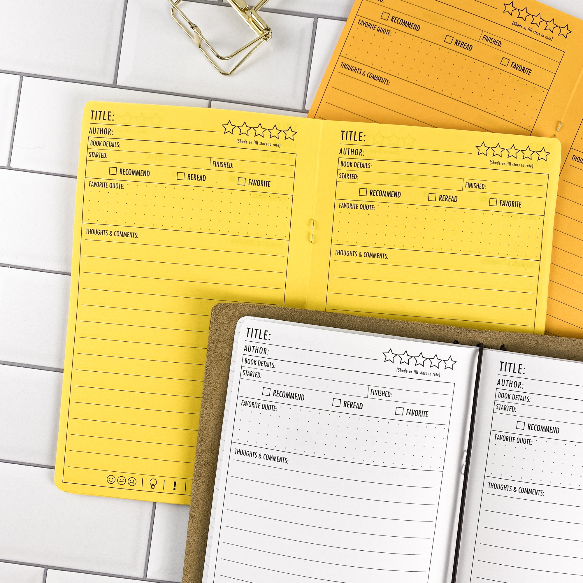 Close-up detail of the Book Review traveler's notebook refill showing the page layout and book review journal pages for tracking reading and notes in colored paper.