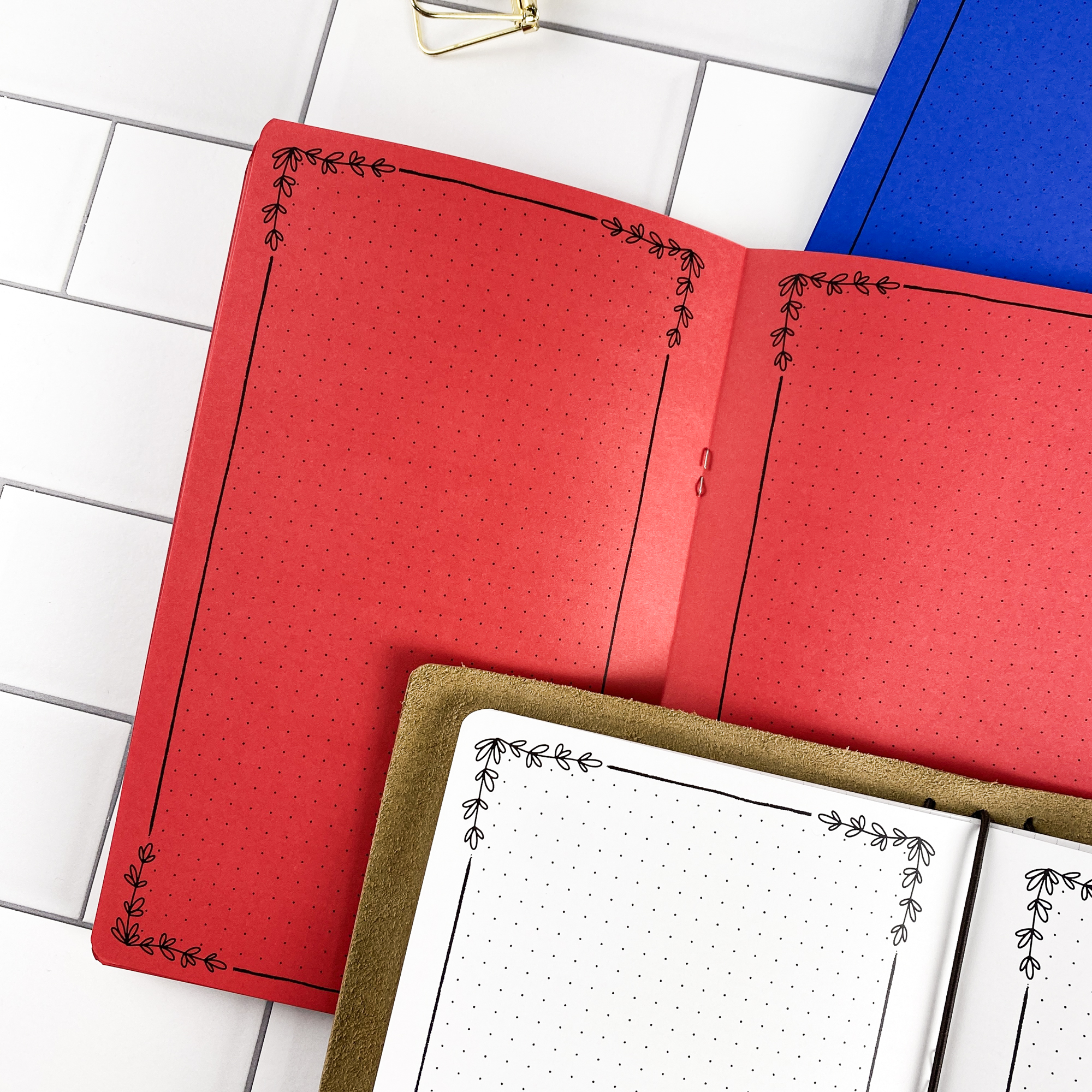 Detail view of the Botanical Notes traveler's notebook refill showing decorative note pages with botanical floral border design, displayed with multiple paper color options.