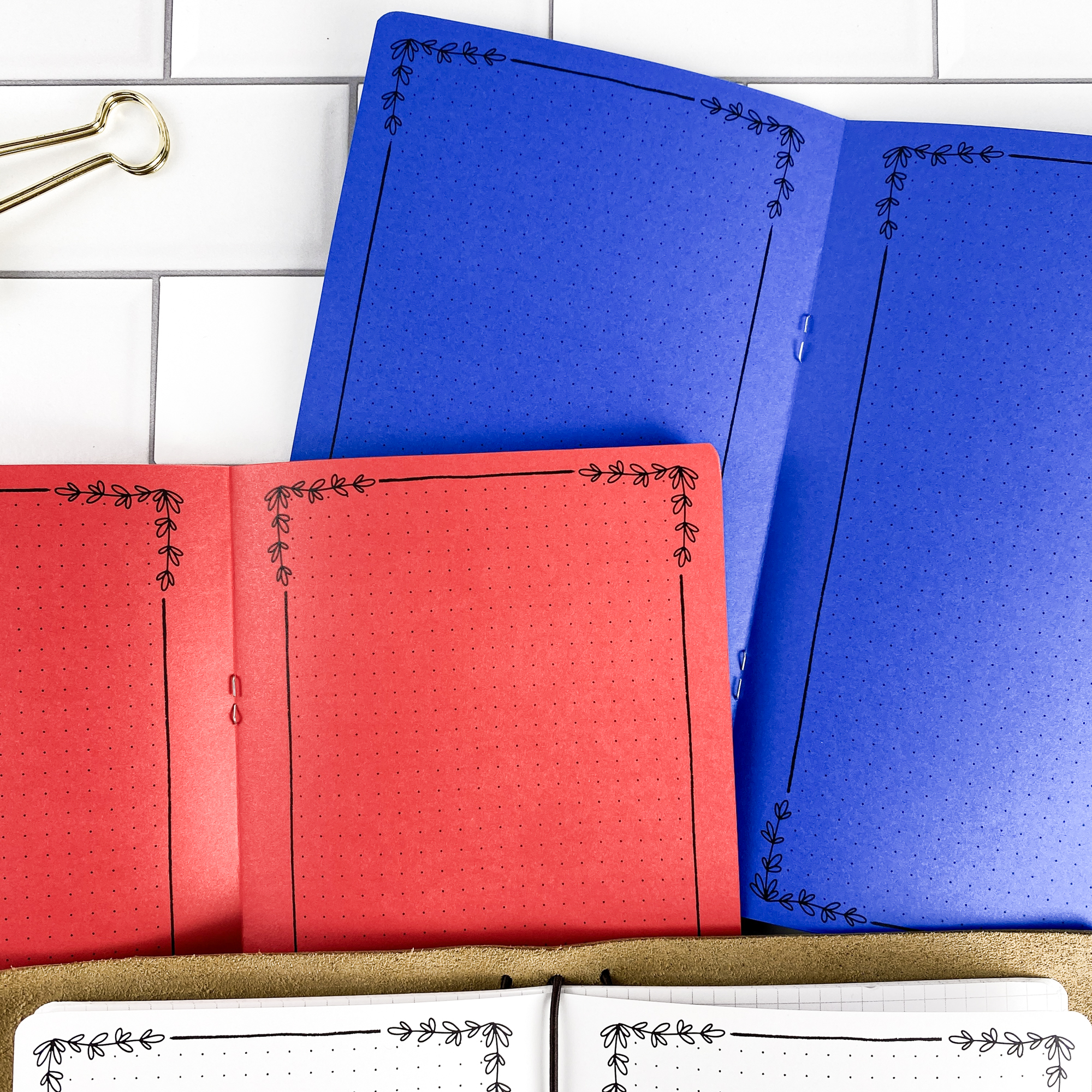 Botanical Notes traveler's notebook refill showing the full page spread with decorative note pages with botanical floral border design in a contrasting paper color.