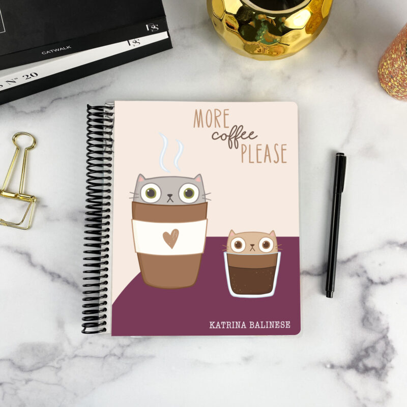7x9 spiral bound planner in the Espurrresso Yourself cover design on a marble surface with styling accessories.