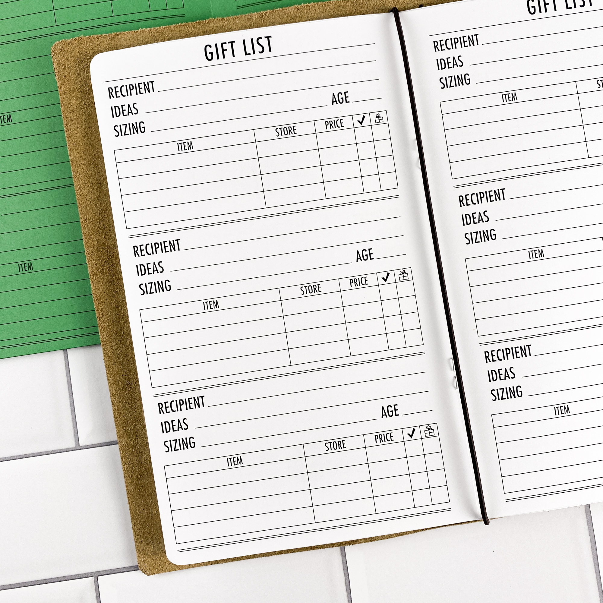 Close-up detail of the Gift List traveler's notebook refill showing the page layout and gift list planning pages for tracking gift ideas and budgets in colored paper.