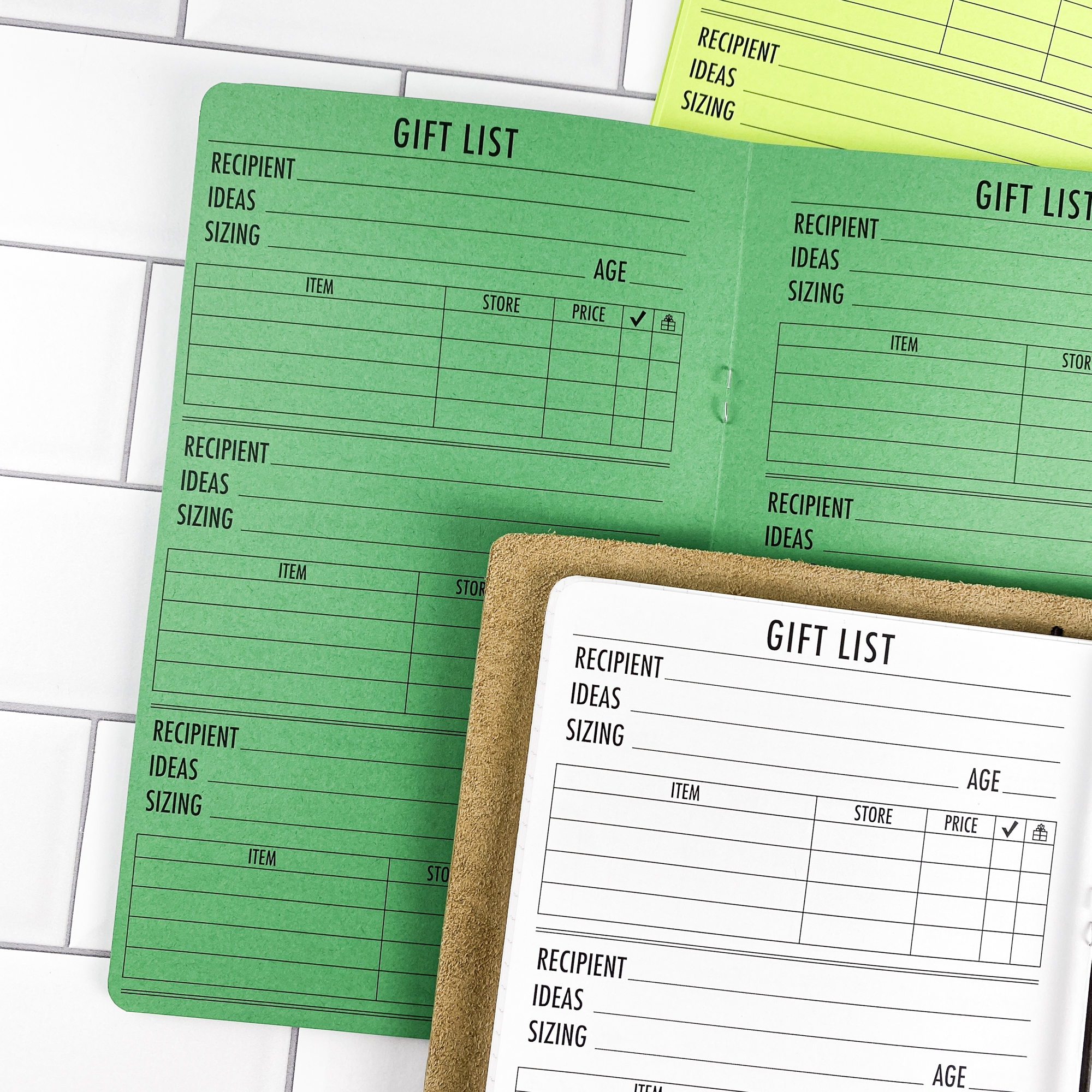 Detail view of the Gift List traveler's notebook refill showing gift list planning pages for tracking gift ideas and budgets, displayed with multiple paper color options.
