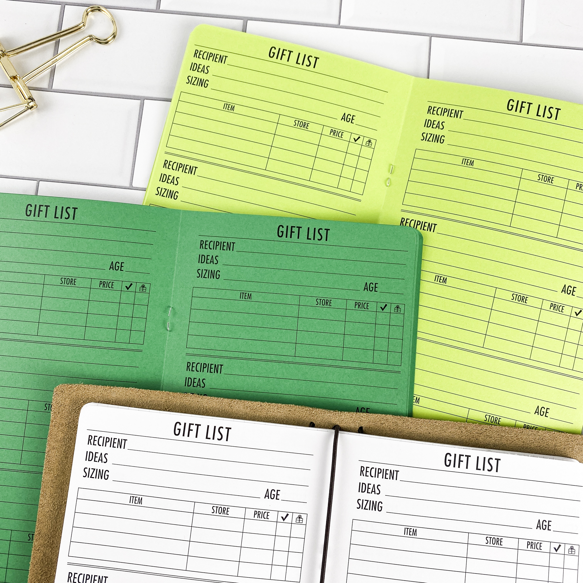 Gift List traveler's notebook refill showing the full page spread with gift list planning pages for tracking gift ideas and budgets in a contrasting paper color.
