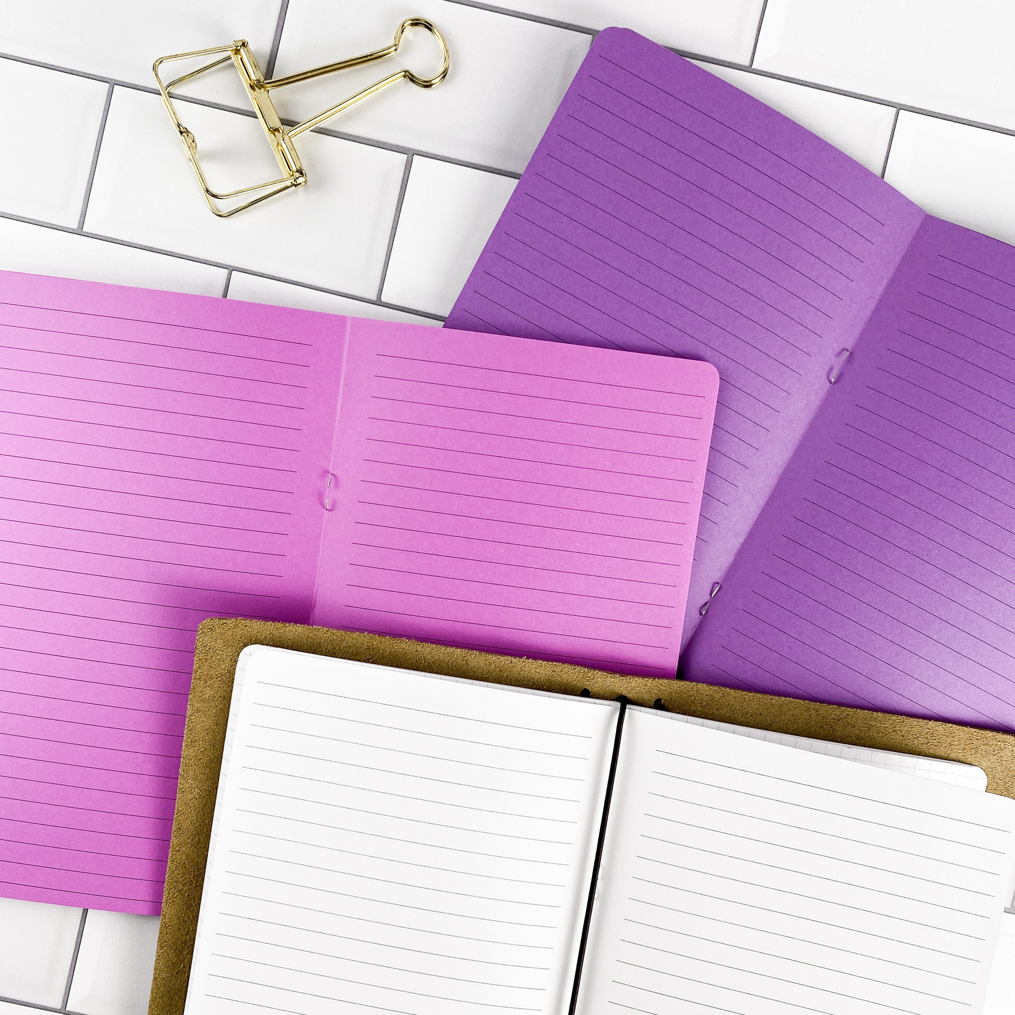 Lined traveler's notebook refill showing the full page spread with lined pages for everyday note taking in a contrasting paper color.