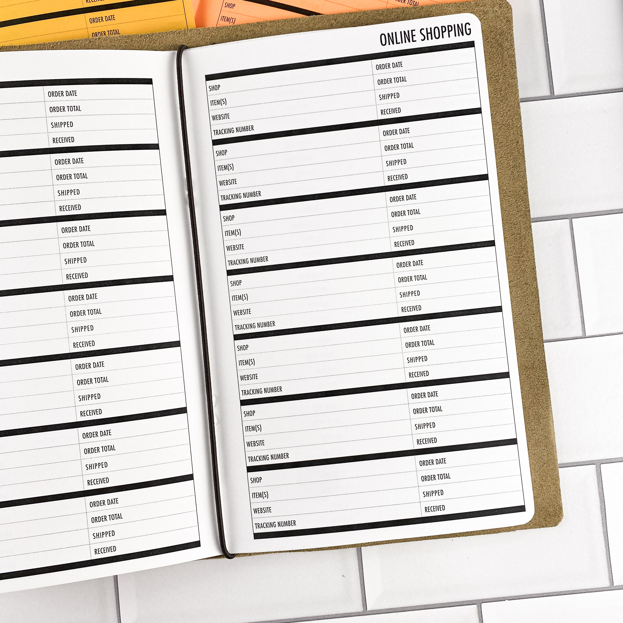 Close-up detail of the Online Shopping traveler's notebook refill showing the page layout and online shopping tracker pages for managing orders and deliveries in colored paper.