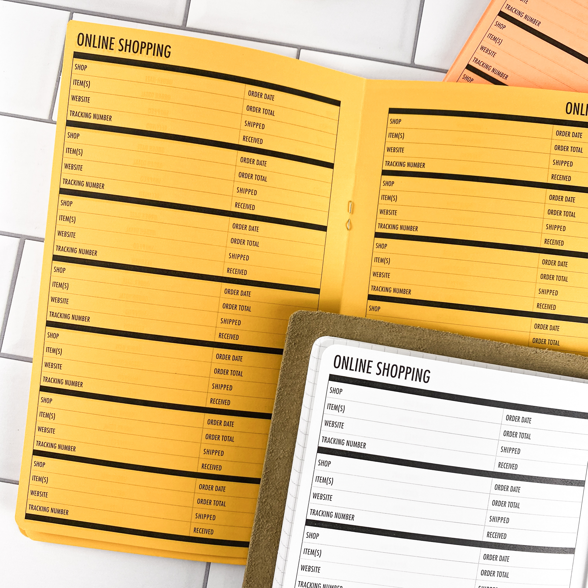 Close-up detail of the Online Shopping traveler's notebook refill showing the page layout and online shopping tracker pages for managing orders and deliveries in colored paper.