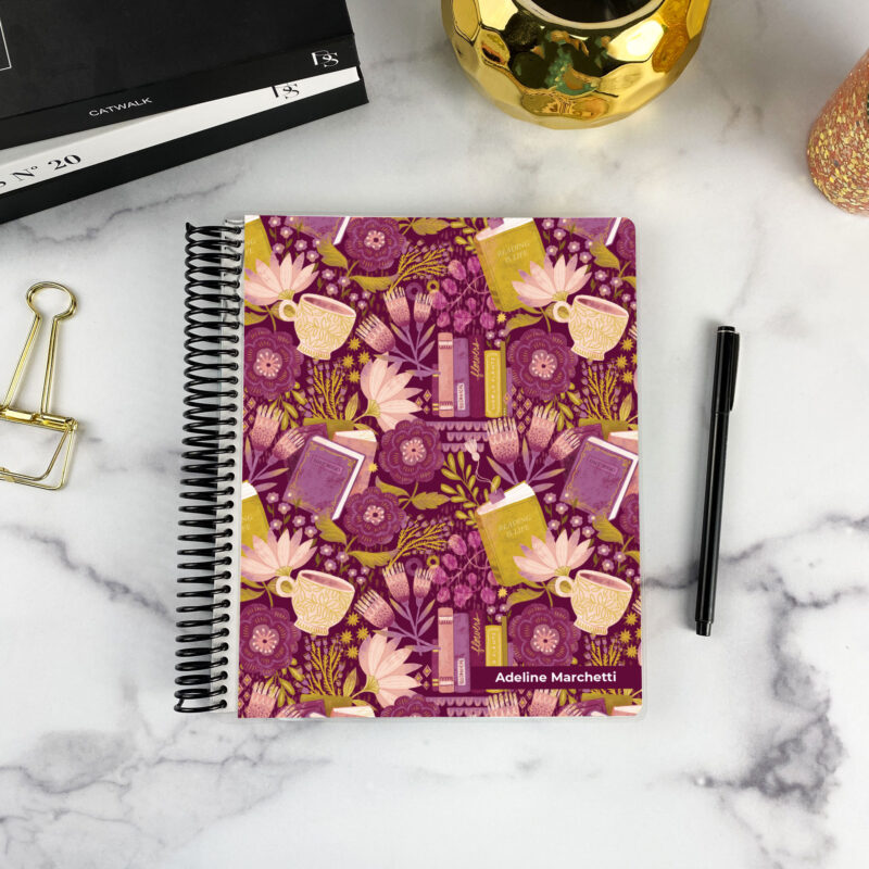 7x9 spiral bound planner in the Reading Nook cover design on a marble surface with styling accessories.