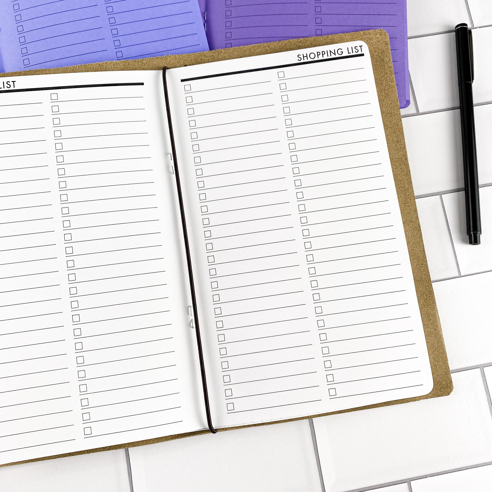 Close-up detail of the Shopping List traveler's notebook refill showing the page layout and shopping list pages for organizing grocery and errand lists in colored paper.