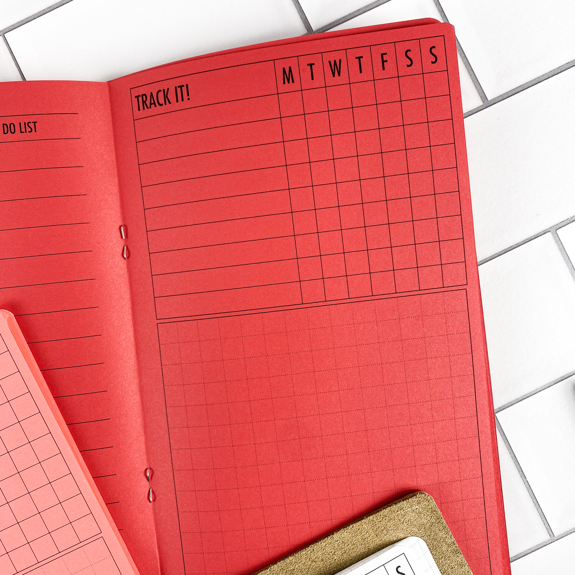 Week at a Glance traveler's notebook refill showing the full page spread with weekly planner spread showing a full week at a glance in a contrasting paper color.