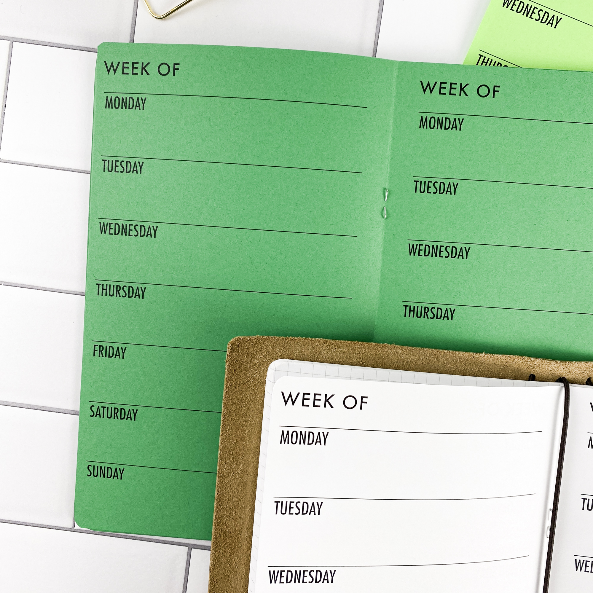 Close-up detail of the Week on 1 Page Horizontal traveler's notebook refill showing the page layout and horizontal weekly planner layout fitting a full week on one page in colored paper.