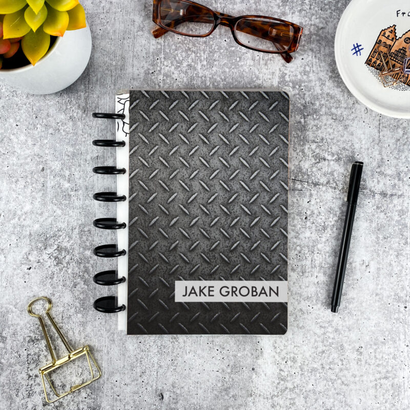 Personalized disc bound password book in diamond deck pattern with laminated cover, black discs, and custom name