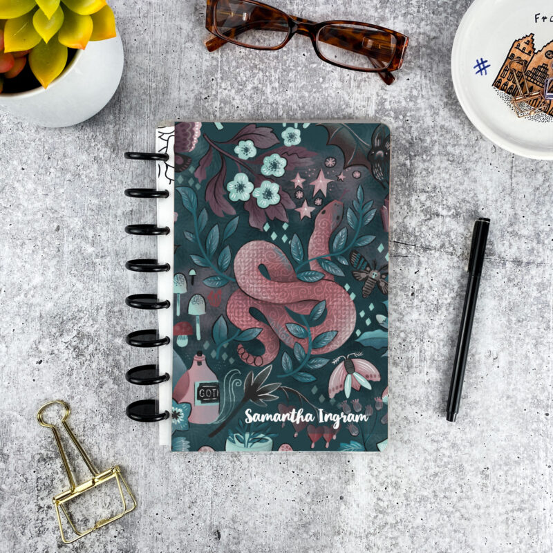 Personalized disc bound password book in gothic snake pattern with laminated cover, black discs, and custom name