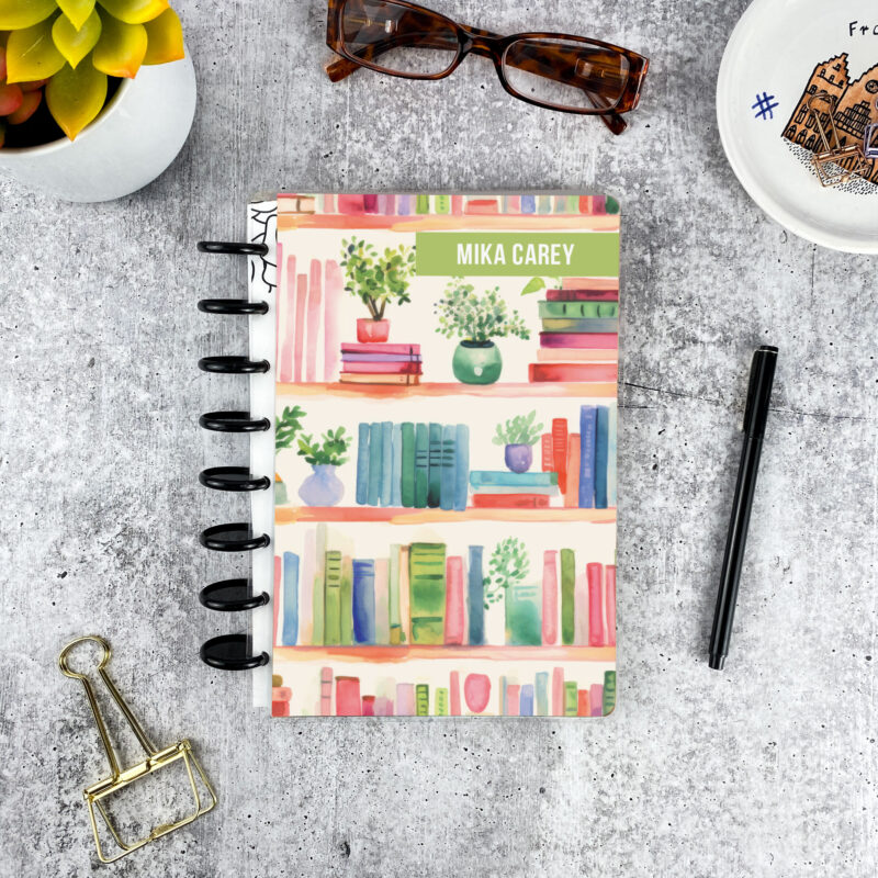 Personalized disc bound password book in book shelf pattern with laminated cover, black discs, and custom name